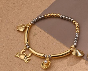 Ocean Muse Gold Charm Bracelet