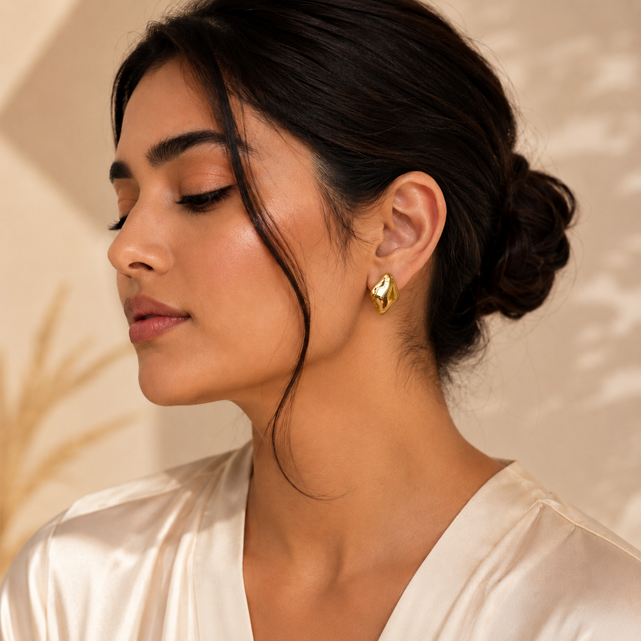 Second image of Geometric Gold Statement Stud Earrings