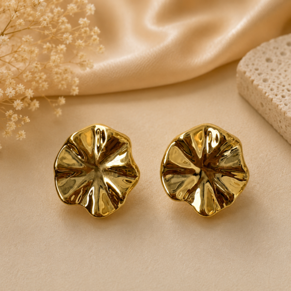 Floral sculpted gold statement stud earrings with petal-inspired design and mirror-polished finish. Suggested SKU