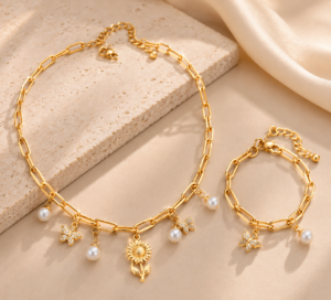 Gold-tone choker necklace featuring elegant pearl drop charms on a delicate chain