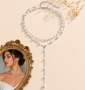 Double-layer faux pearl Y-necklace with silver-tone chain and adjustable clasp displayed on a neutral background.