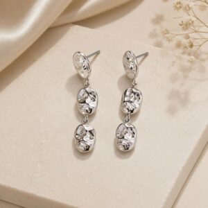 Elegant silver-tone triple drop dangle earrings with a textured organic design for women.
