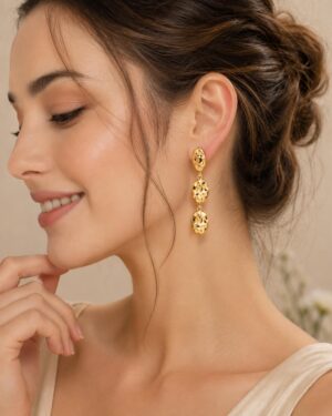 Elegant golden-tone triple drop dangle earrings with a textured organic design for women.