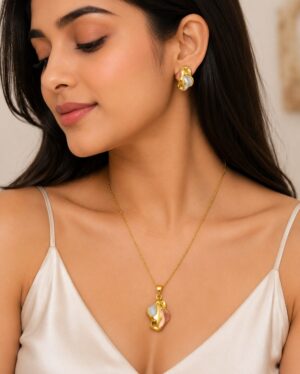 Premium gold finish stainless steel abstract pendant necklace and stud earrings set for women with white and blush accents.